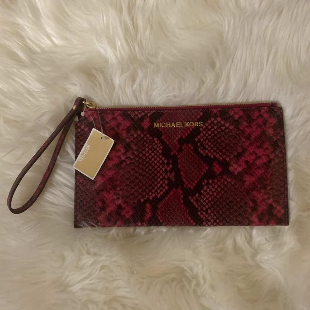 Brand new Michael Kors fuchsia snakeskin wristlet